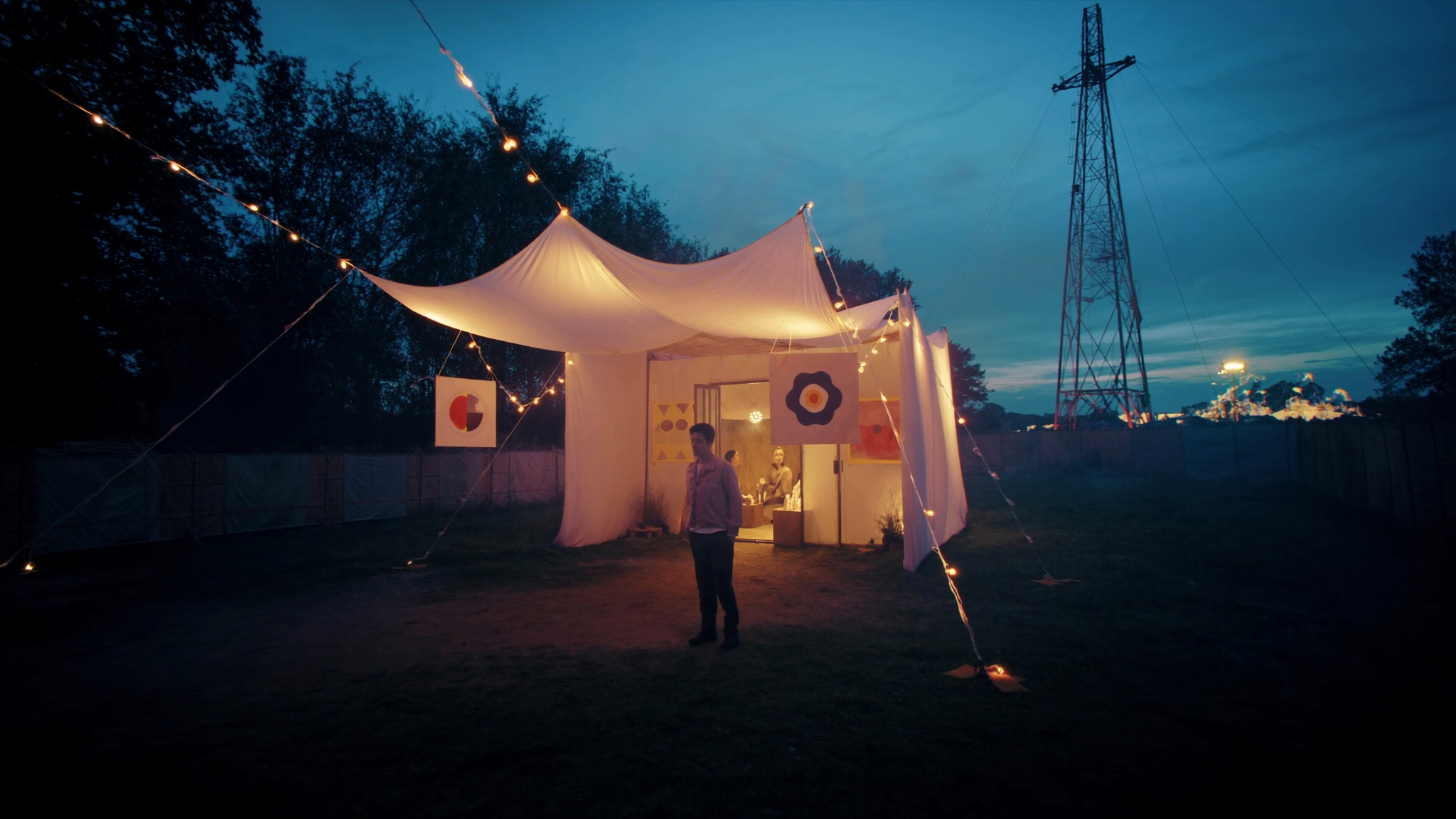 Work shown outdoors at a festival, evening light